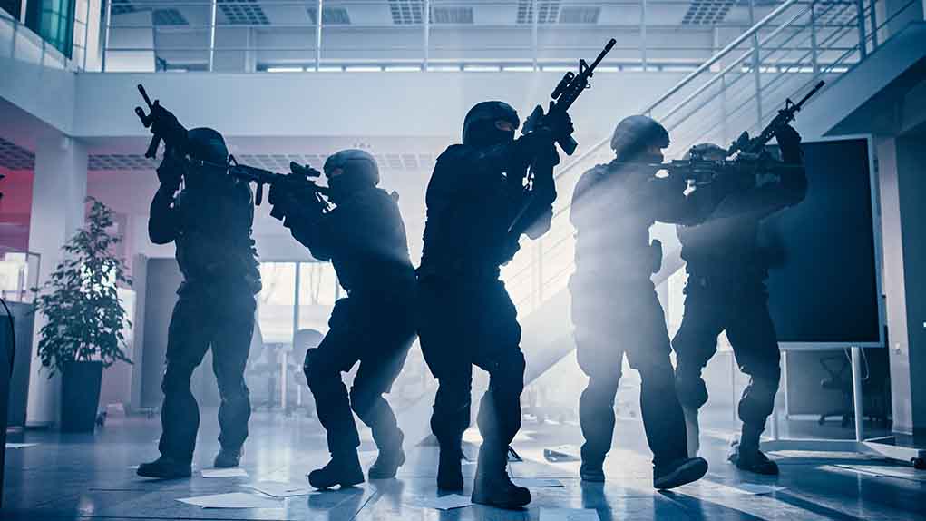 SWAT team in a raid, tactical formation.
