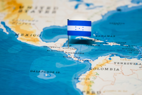 Map with Honduras flag pin in Central America.