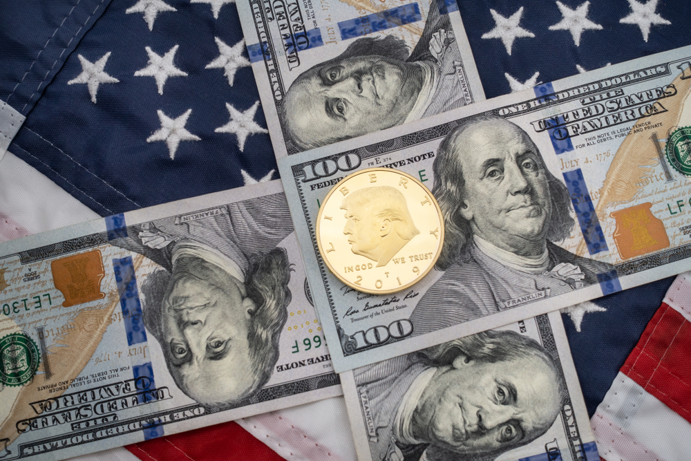 American flag background with hundred dollar bills and coin