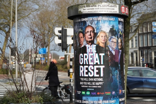Poster with the title The Great Reset on street