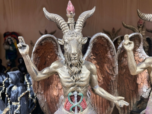 Statue of Baphomet with wings and occult symbols.