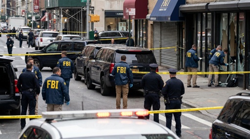 FBI agents and police officers at a crime scene with police tape